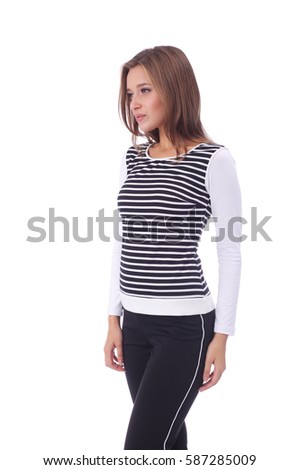 pretty young girl wearing striped top and black pants