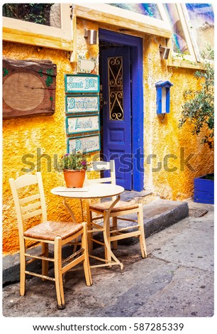 Colorful Greece - old streets with small tavernas, retro styled picture