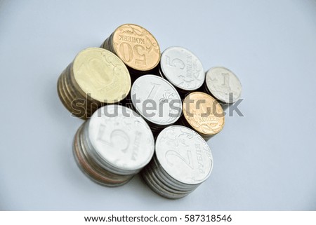 stacks of coins on a white surface