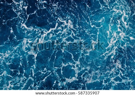 Background shot of aqua sea water surface Royalty-Free Stock Photo #587335907