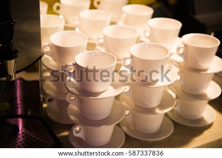 Coffee mugs, mugs for tea around the coffee machine background