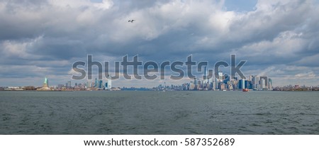 Panoramic view of Lower Manhattan Skyline and Libery Island and Liberty Statue - New York, USA