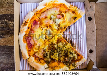 Fresh hot Hawaiian Pizza on paper box, top view
