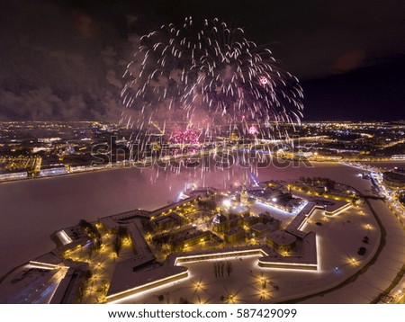  Aerial view of Fireworks over the Peter and Paul Fortress, Palace bridge, Old Stock Exchange, Winter Palace, night illumination, river Neva as mirror, snow