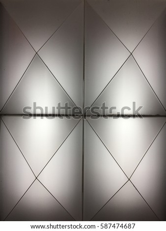 Black and white pattern on wall, The walls are illuminated with inside light.
