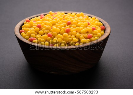 Sweet Boondi or Bundi in raw form, main ingradient of Motichoor laddoo or can eat as is. Indian food. Served in a bowl. Selective focus