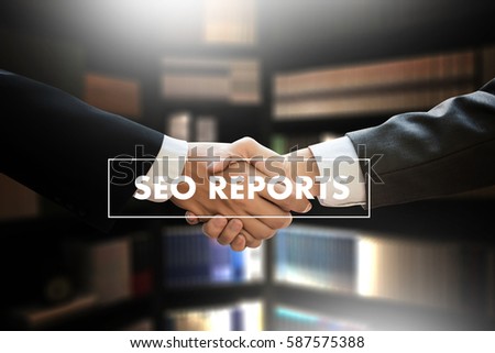 SEO REPORTS Concept Business team hands at work with financial reports and a laptop