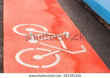 A sign on a red road bike, Bicycle lane sign on street 