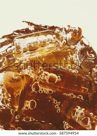 ice tube and lemon tea in glass , closeup Royalty-Free Stock Photo #587594954