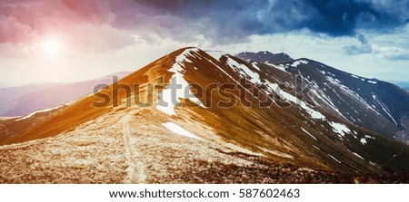 Gloomy view of the snow range under overcast sky. Dramatic scene and picturesque picture. Location place Carpathian, Ukraine, Europe. Beauty world. Retro and vintage style. Instagram toning effect.
