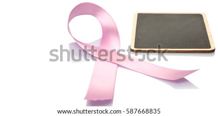 Concept image of breast cancer awareness pink ribbons with blank mini blackboard over white background