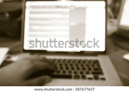 Picture blurred  for background abstract and can be illustration to article of hand people woking with laptop