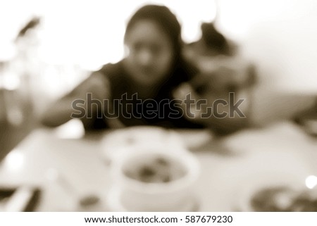 Picture blurred  for background abstract and can be illustration to article of woman eating food in restaurant