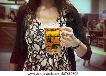lady is holding a beer, picture vintage effect