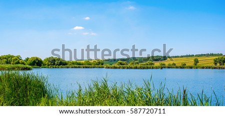 Photo of nature around beautiful blue lake at summer