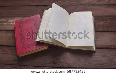 Open book with space for your text on wooden table .
 