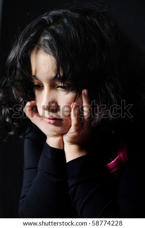 sad girl sitting in dark