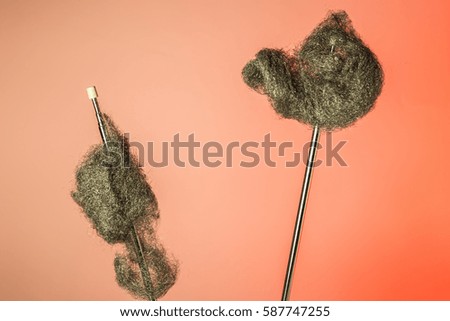 Antenna with steel wool at an old red background