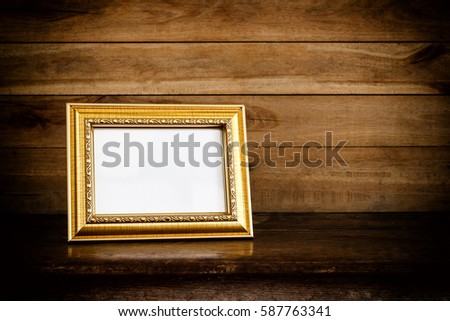 photo frame on grunge wooden background
