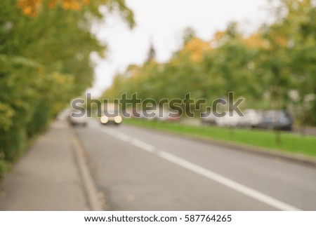 blurred background of autumn town street, real lens bokeh