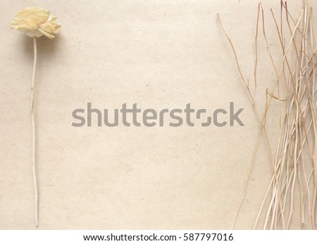 Blank craft background. Sheet of rough paper with dry flower. Mock up for letter writing, creative work concept Royalty-Free Stock Photo #587797016