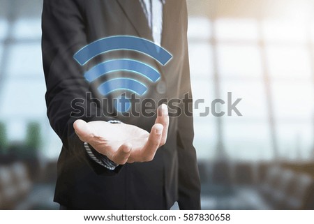 Businessman with wifi zone system icon. concept technology social network communication.