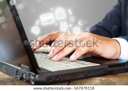 Businessman typing laptop keyboard, e commerce business concept