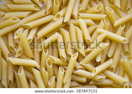 Pasta background, texture, close-up Italian Penne, high resolution picture 