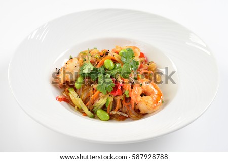 Japanese udon wheat noodles with tiger prawns, white background
