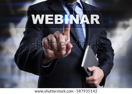 Businessman is pressing button on touch screen interface and selecting webinar.