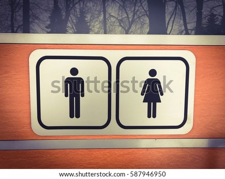 Public toilet signs on the door
