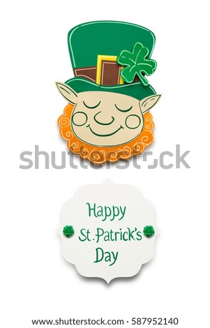 Creative St. Patricks Day concept photo of a leprechaun made of paper on white background.