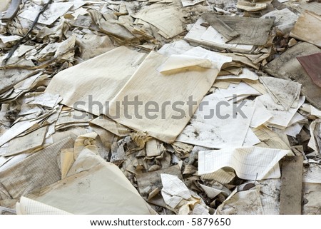 Heap of old papers on a floor of the thrown factory. ex-USSR. 2007 year.