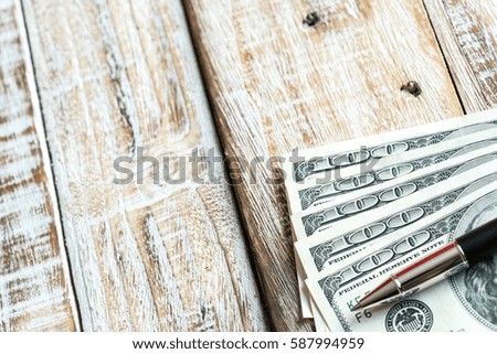 Money dollars on wooden background, business concept.