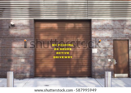no parking sign on garage door in Manhattan