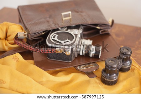 vintage bag, video camera, camera and binoculars