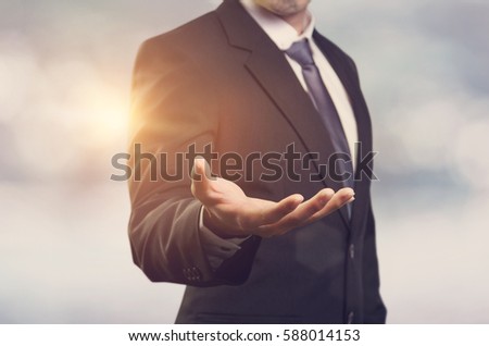 Businessman with empty hand, copy space