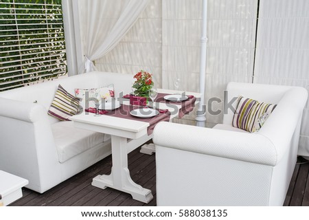 beautiful table and chairs on the terrace in the interior