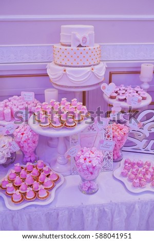 beautiful buffet tables with a sweet and decorations