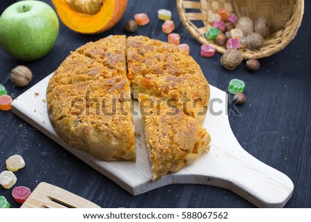 Apple pie and fruits on wooden table, top view