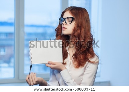 brunette business notebook in the hands..