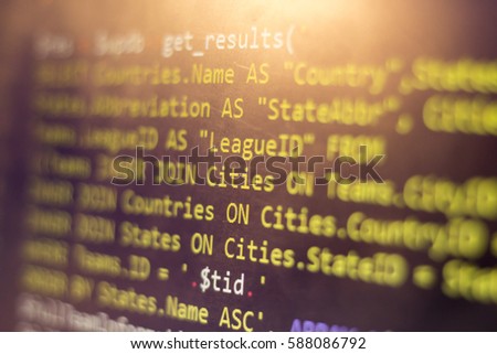 Web developer PHP code close up. Macro shot of complicated SQL query to database. Abstract information technology modern background. Concept screen of experienced software developer.