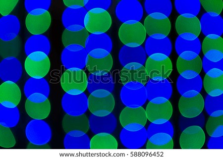 Abstract colorful background, blurred bokeh lights on multicolored backdrop, floating round circle shapes or bubbles