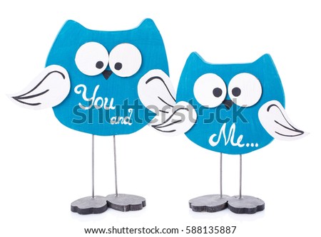 a fun family Wooden toy owl on a white background.