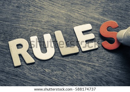 Hand arrange wood letters as Rules word Royalty-Free Stock Photo #588174737