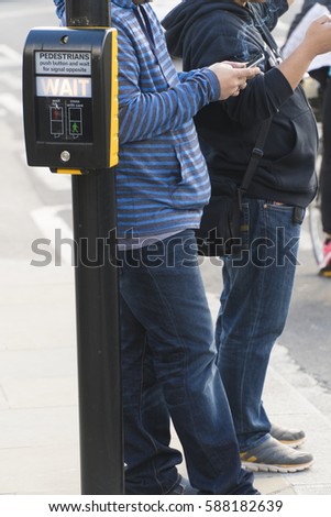 Crosswalk button for pedestrian, London UK