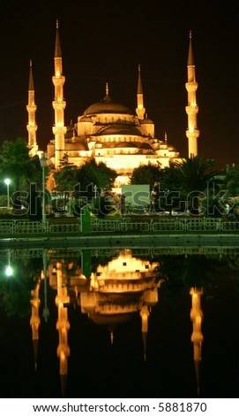 Blue Mosque by night mirroring in lake