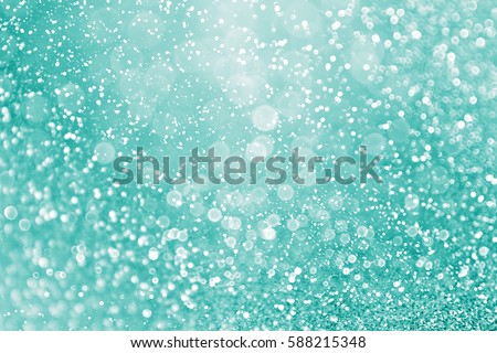 Abstract elegant teal green glitter sparkle confetti background for turquoise happy birthday party invite, aqua mint wedding celebration poster, Christmas bokeh dream gala pattern or holiday texture Royalty-Free Stock Photo #588215348