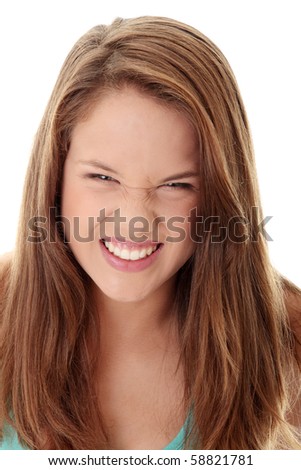 Close Up Shot of a Beautiful Angry Teenager, isolated on white background