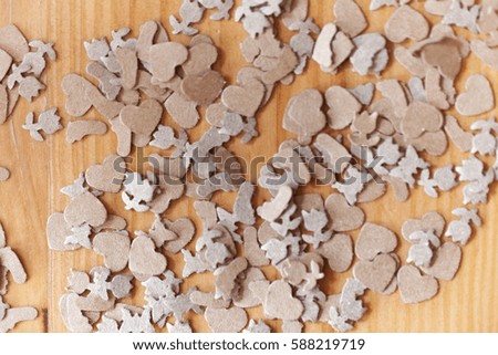 Macro photo of brown paper shavings on wood.